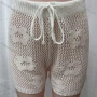 Wholesale Women's Vacation Hollow Out Semi-Sheer Drawstring Plain Floral Design Shorts 80318# preview